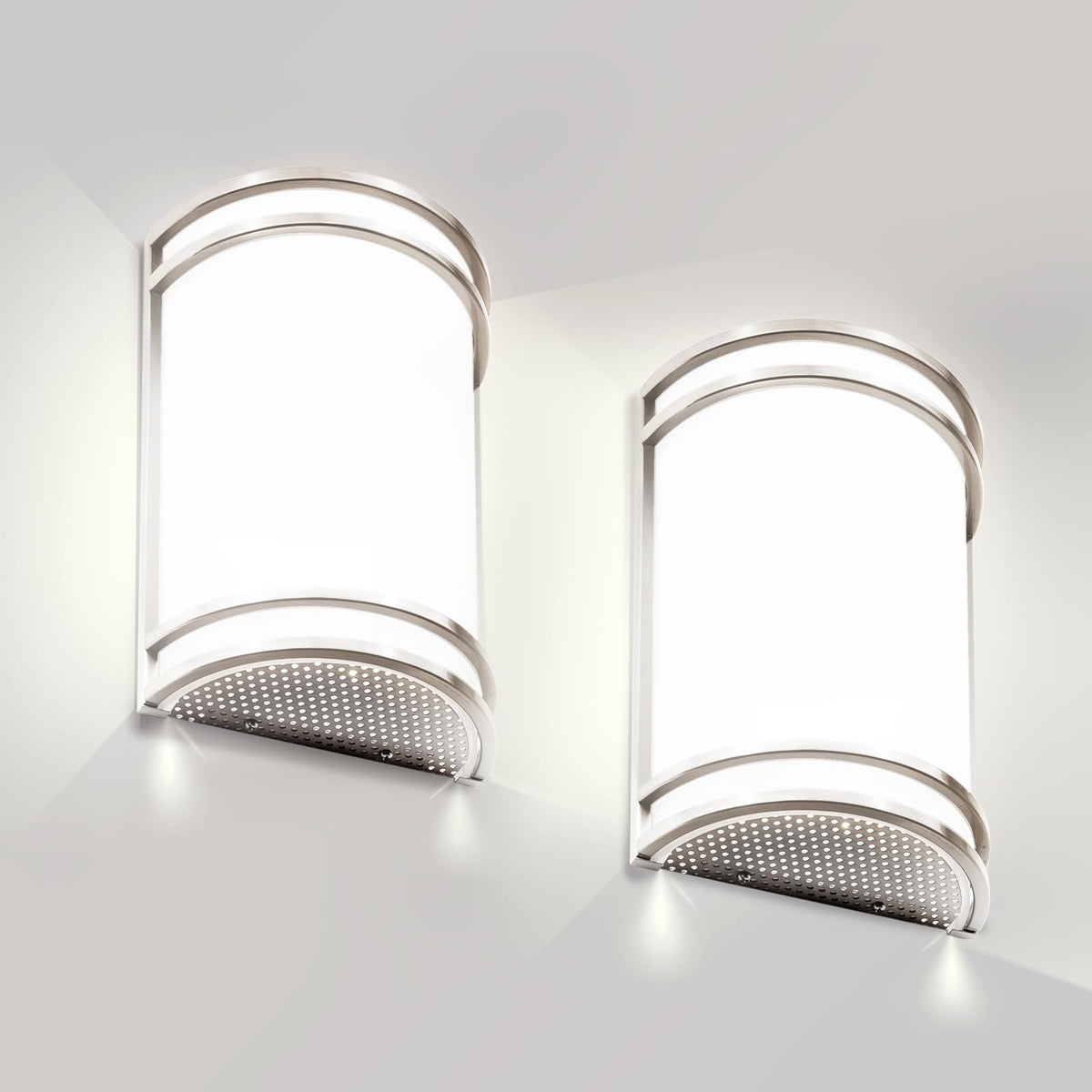 Flynix half-cylinder wall sconce in brushed nickel delivers warm ambient lighting.