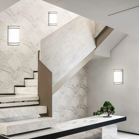 Flynix hallway installation; half-cylinder sconce delivers even wall illumination.