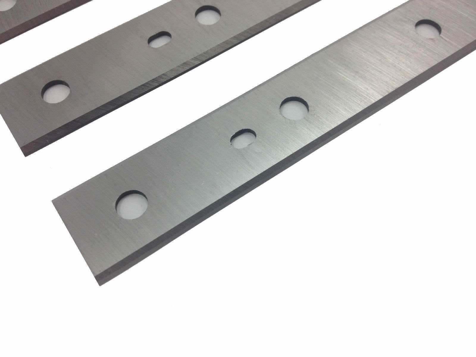 FOXBC reversible blades with locator holes shown during knife change.
