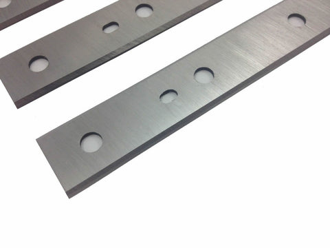 FOXBC reversible blades with locator holes shown during knife change.