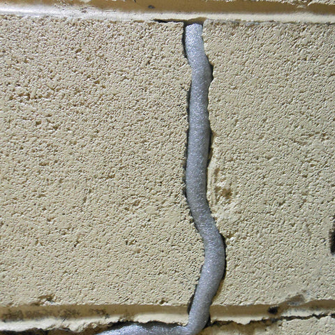 Frost King durable poly foam caulk saver in grey for long runs.