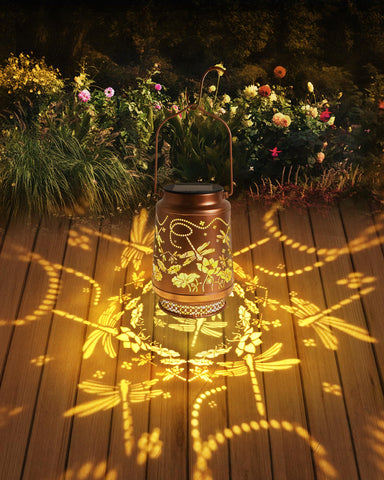 Fussion Dragonfly lantern with gold copper finish enhances yard decor.