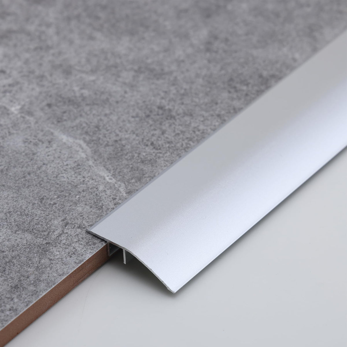 Gaahing aluminum floor transition strip shows gap-bridge for seamless room transitions