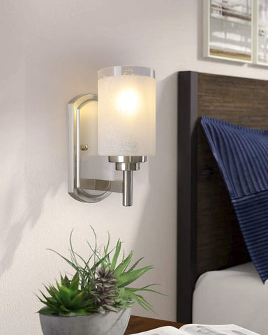 Galtlap sconce with frosted glass shade for soft bedroom illumination.