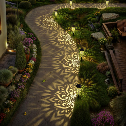 Gardencave solar lights with a black finish blend along borders and steps.