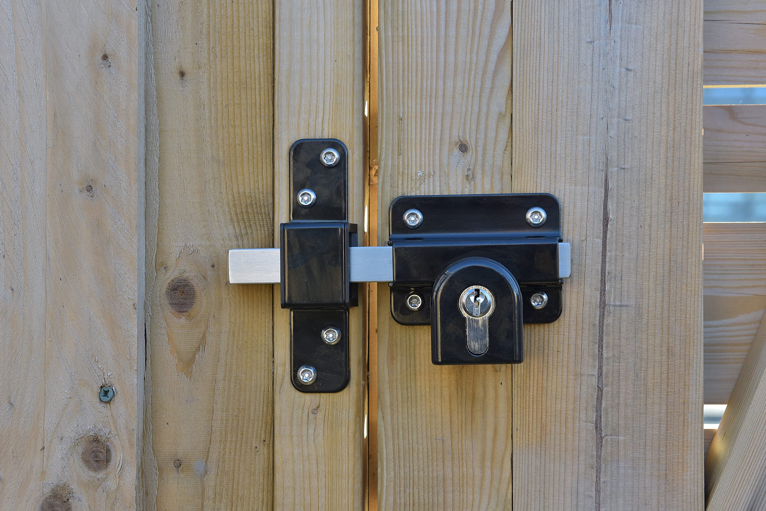 Gatemate gate lock with black finish installed on gate highlighting weatherproof look