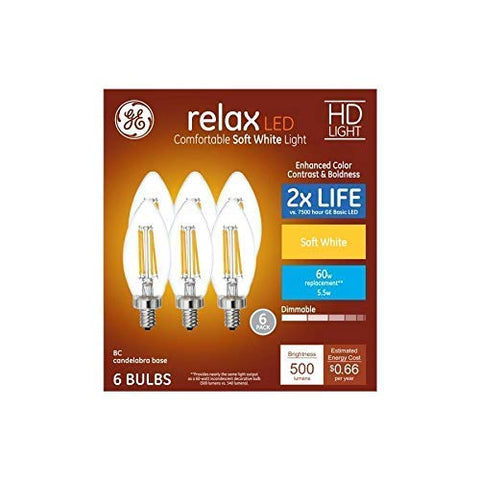 GE Soft White decorative LED candle bulbs in a lamp create warm, cozy lighting for living rooms.