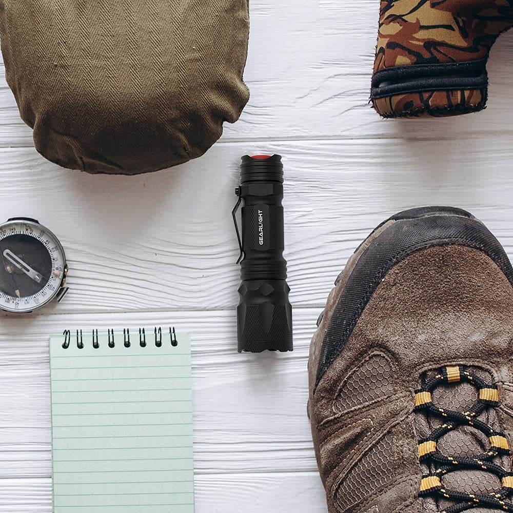 GearLight M3 mini flashlight clipped securely for on-the-go transport.
