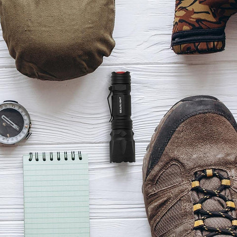 GearLight M3 mini flashlight clipped securely for on-the-go transport.