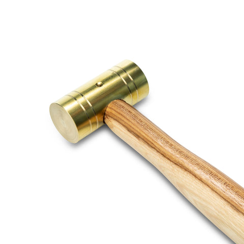 GearWrench brass hammer with flame-treated hickory handle securely wedged into head