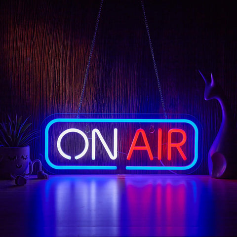 Geewkooy ON AIR neon sign glows blue, white, and red to elevate room ambiance.