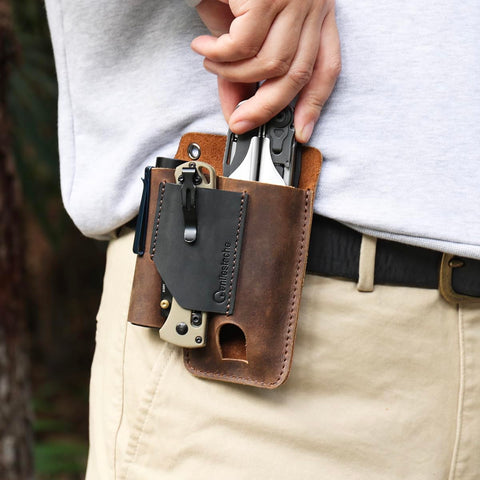 Gentlestache leather multitool sheath on belt demonstrates secure clip for everyday carry.