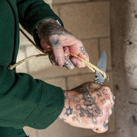 Gerber Paraframe frame-lock handle with dual thumbstuds for one-handed use.