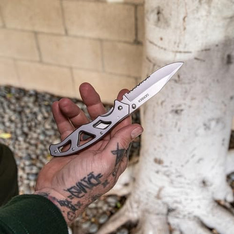Gerber Paraframe partially serrated blade suited for rope and packages.