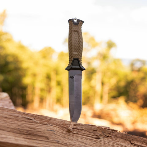 Gerber StrongArm Magnacut coyote brown finish blends with outdoor gear for stealthy carry.