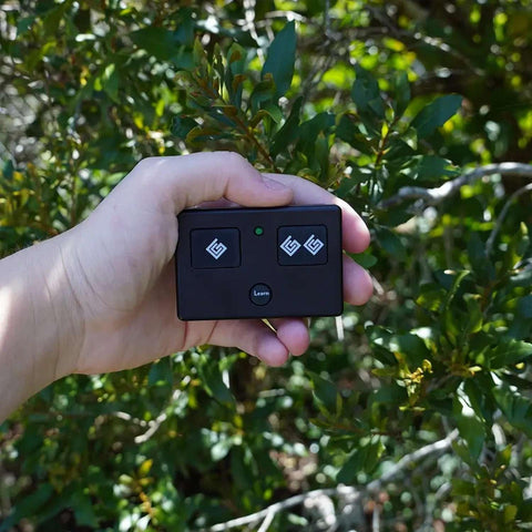 Ghost Controls AXS1 remote compact design suitable for mounting near gate.