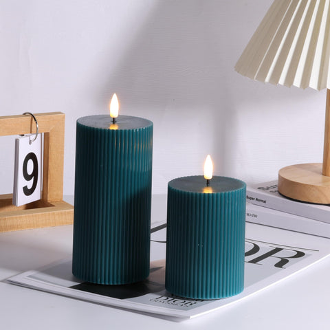 Girimax close-up of wax-textured green ribbed LED candle for realism.