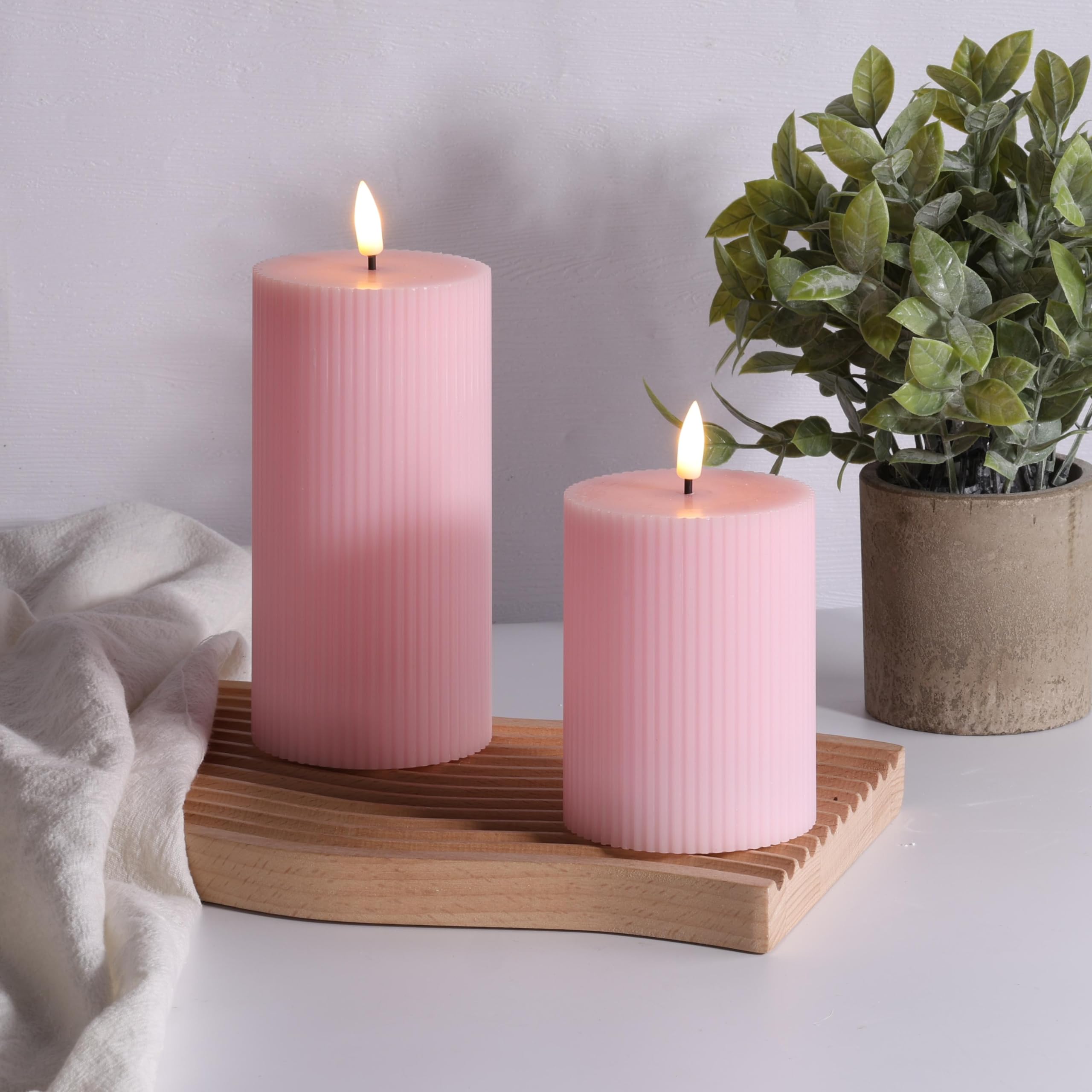 Girimax LED wax candles with warm white glow simulate real flames safely.