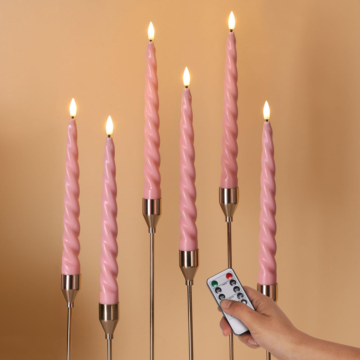 Girimax pink flameless taper candle close-up showing wax-coated realism for cozy ambience.