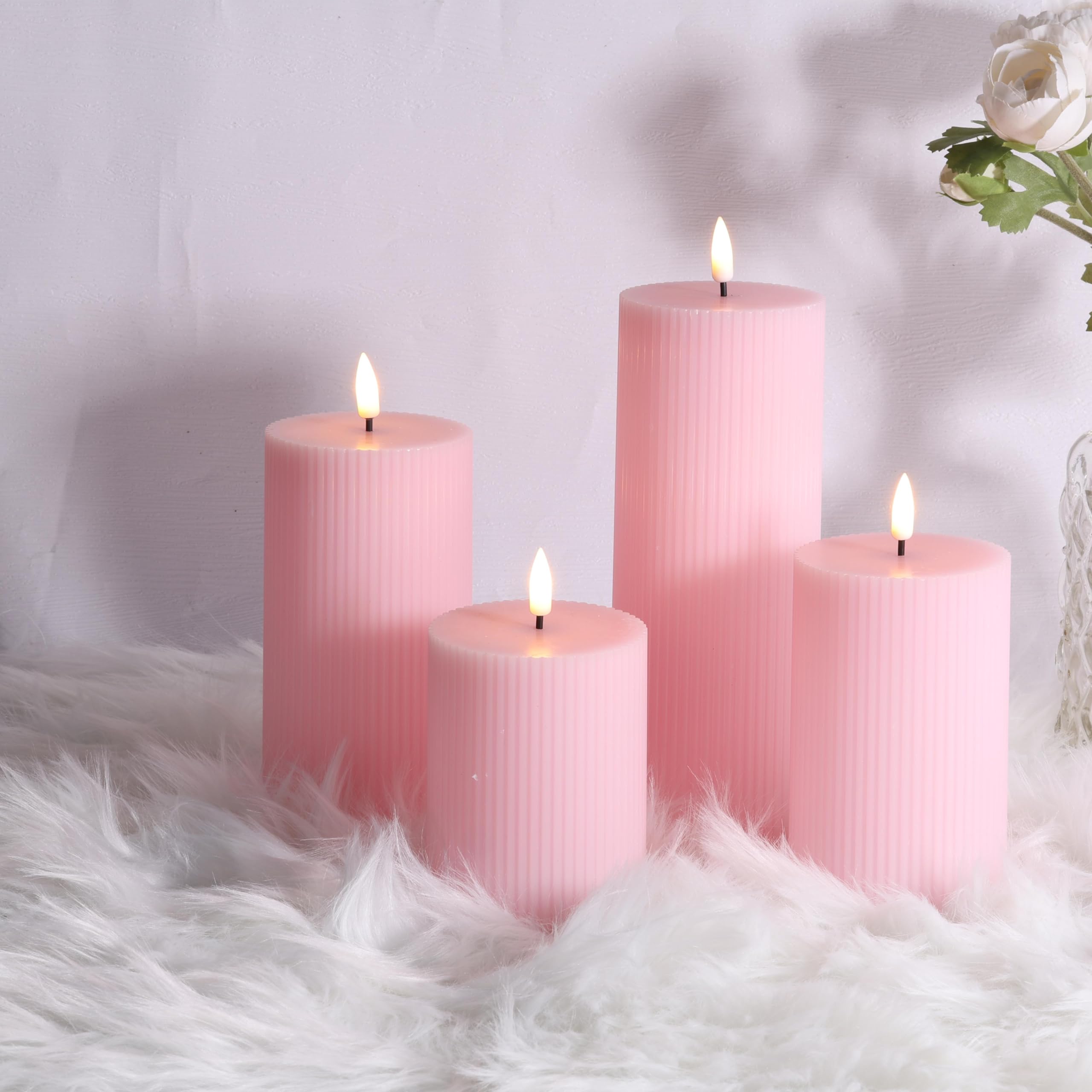 Girimax pink ribbed LED pillar candle with remote control for easy dimming and on/off.