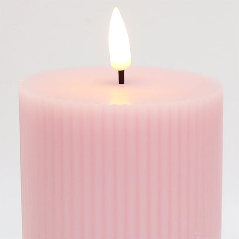 Girimax pink ribbed LED pillar candle smokeless and dripless for safe homes.