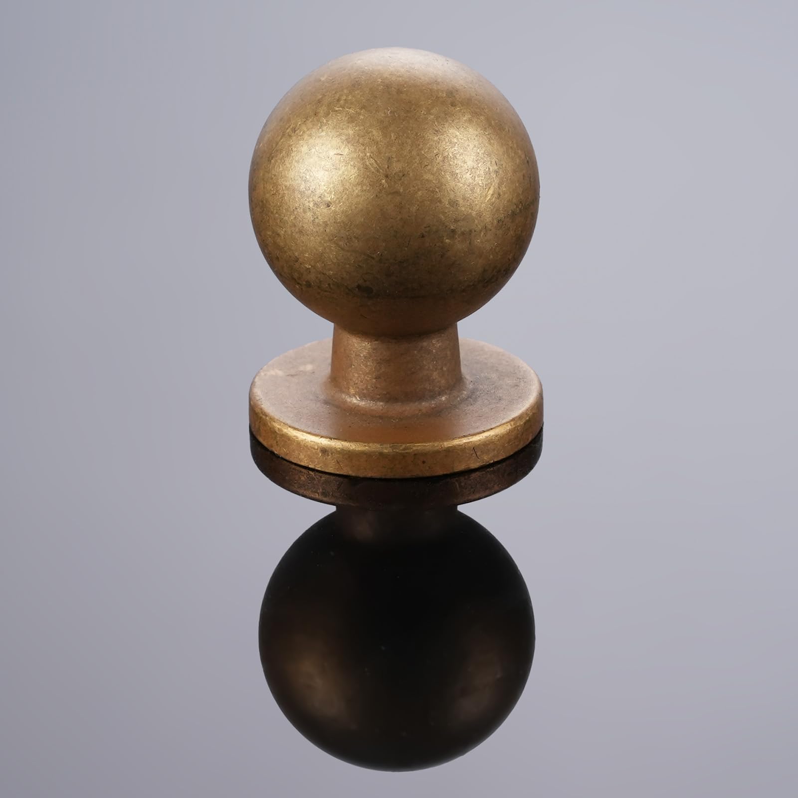 GIYURO antique brass drawer knobs installed on a drawer front