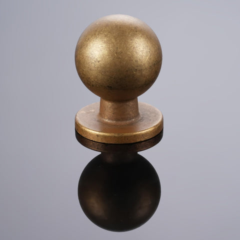 GIYURO antique brass drawer knobs installed on a drawer front