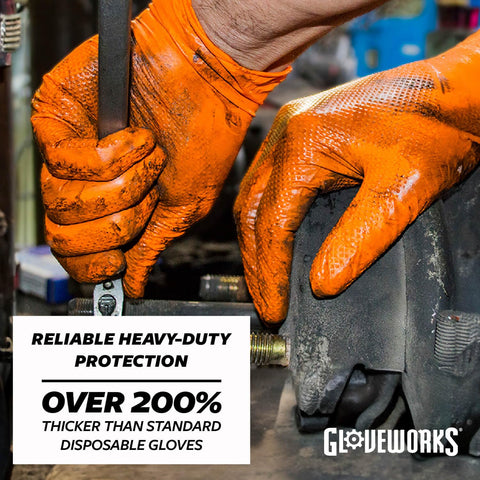 Raised diamond grip on Gloveworks orange nitrile gloves for secure handling