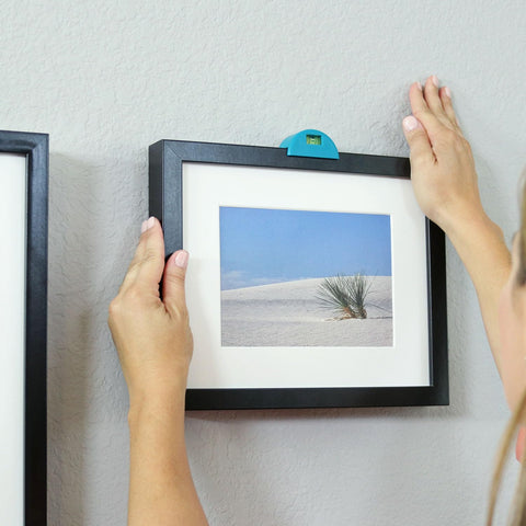 Go Hang It! Pro wall hanging kit helps turn empty walls into galleries.