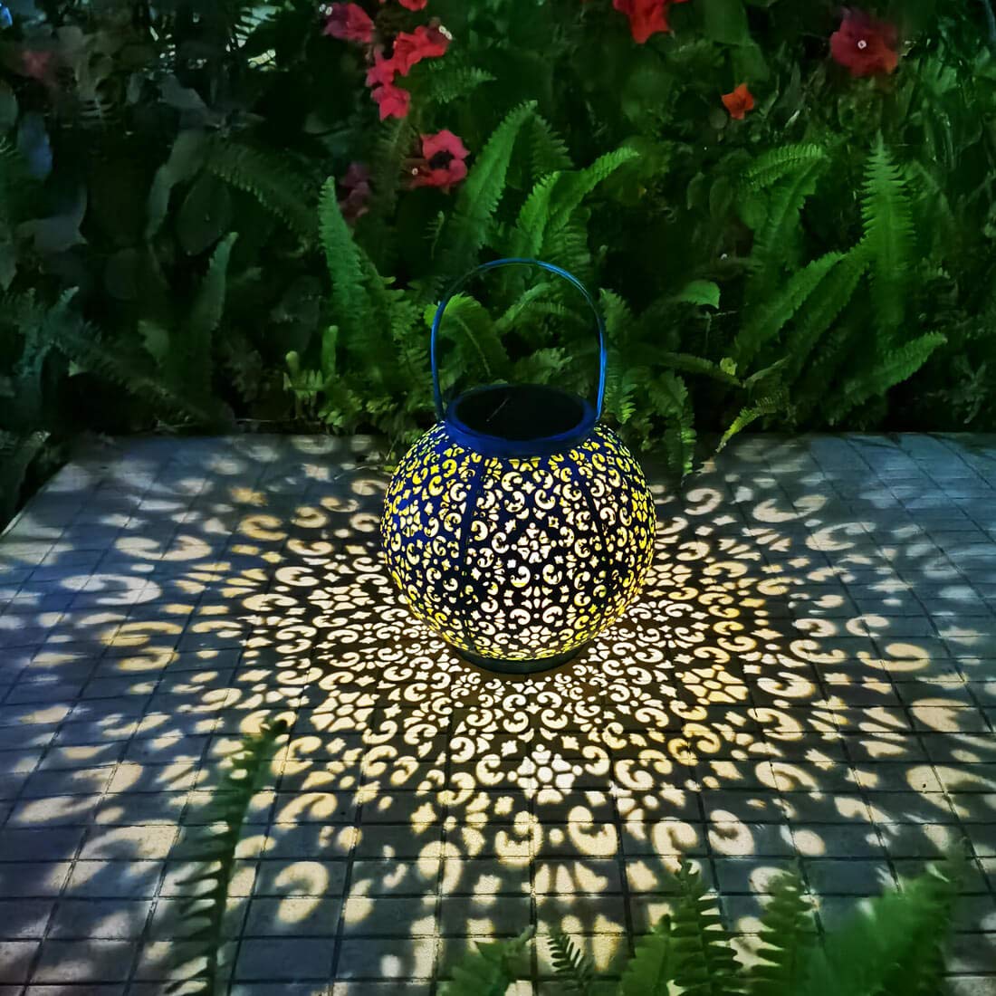 Go2garden teal blue solar outdoor lantern glowing softly on patio at dusk for ambiance.