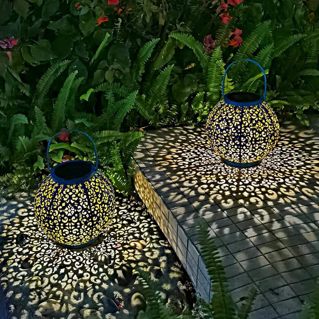 Go2garden decorative pattern on teal lantern enhances yard aesthetics.