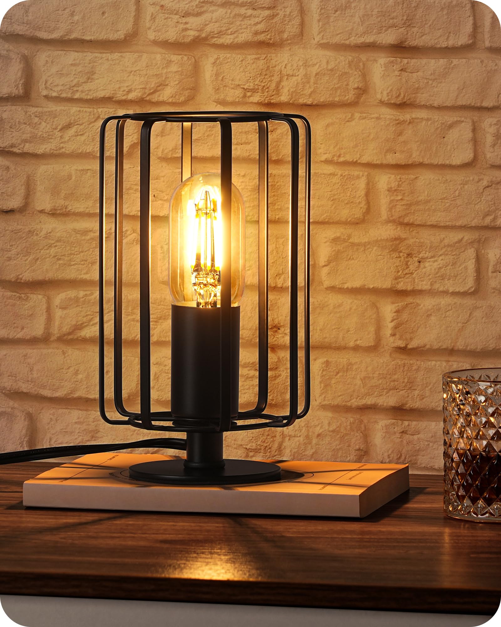 GOEBLESON small table lamp with perforated cage adds vintage industrial charm to a bedroom