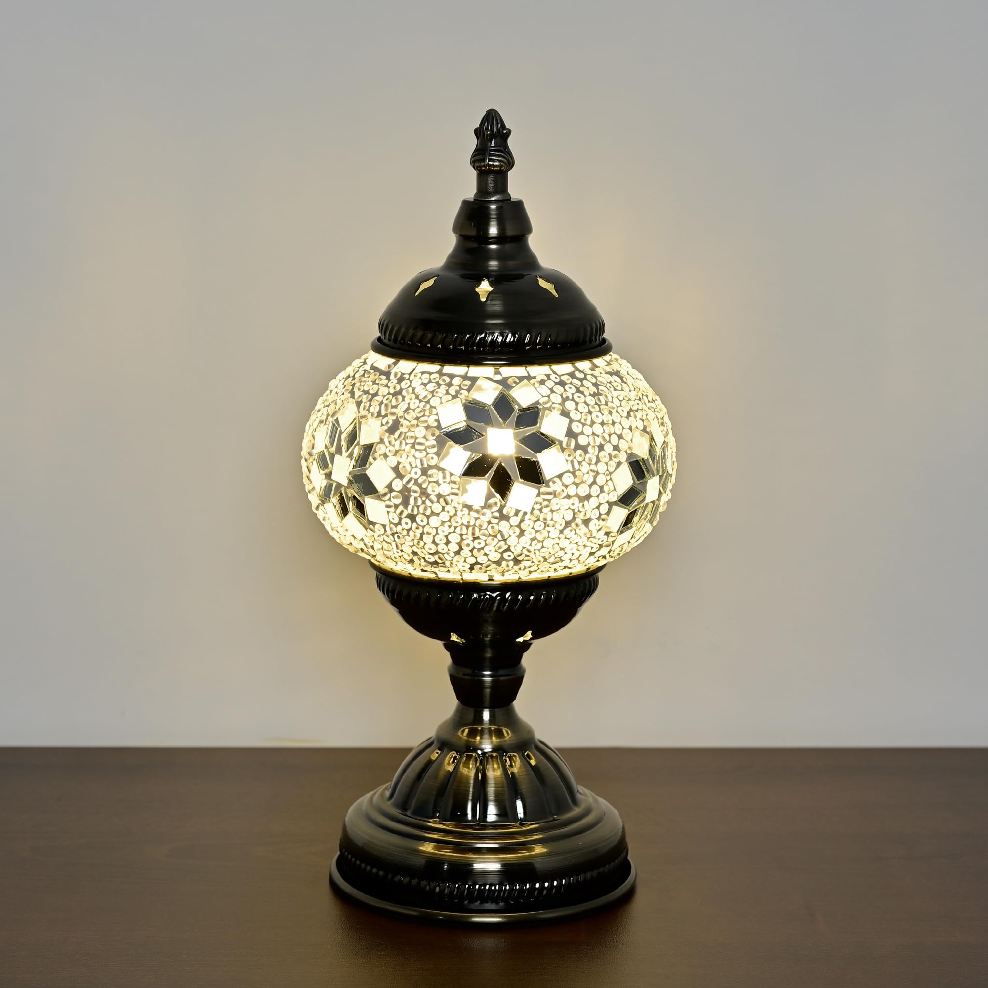 GOGERS bronze base table lamp detail complements modern decor with warm illumination.