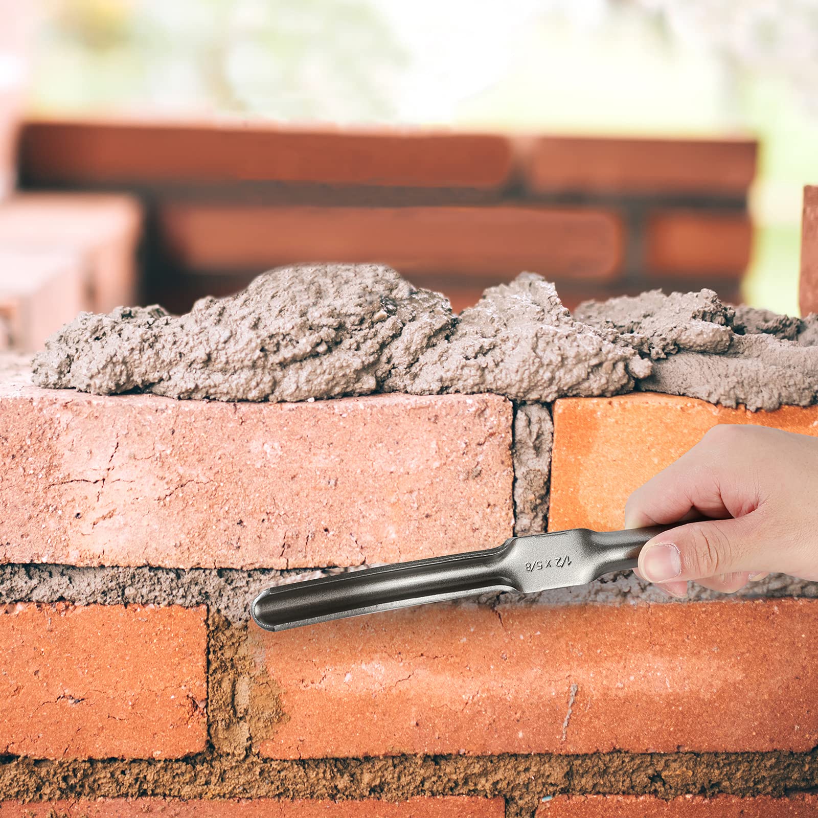 Goldblatt grout applicator features a stainless steel tip for controlled grout application.