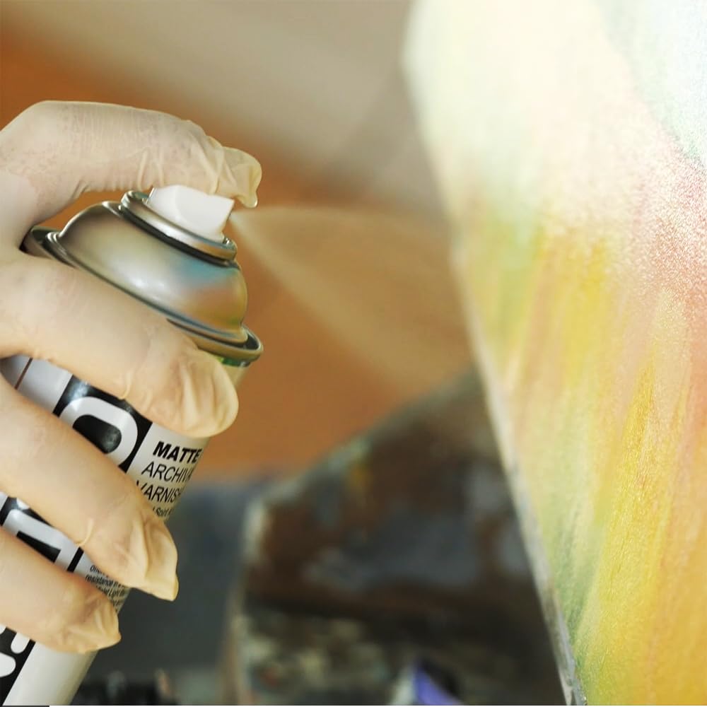 GOLDEN Gloss Archival Varnish spray demonstrates easy, even application for finishing artworks.