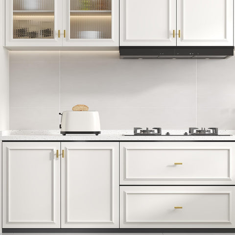 Satin-brushed stainless steel surface with warm brass tone