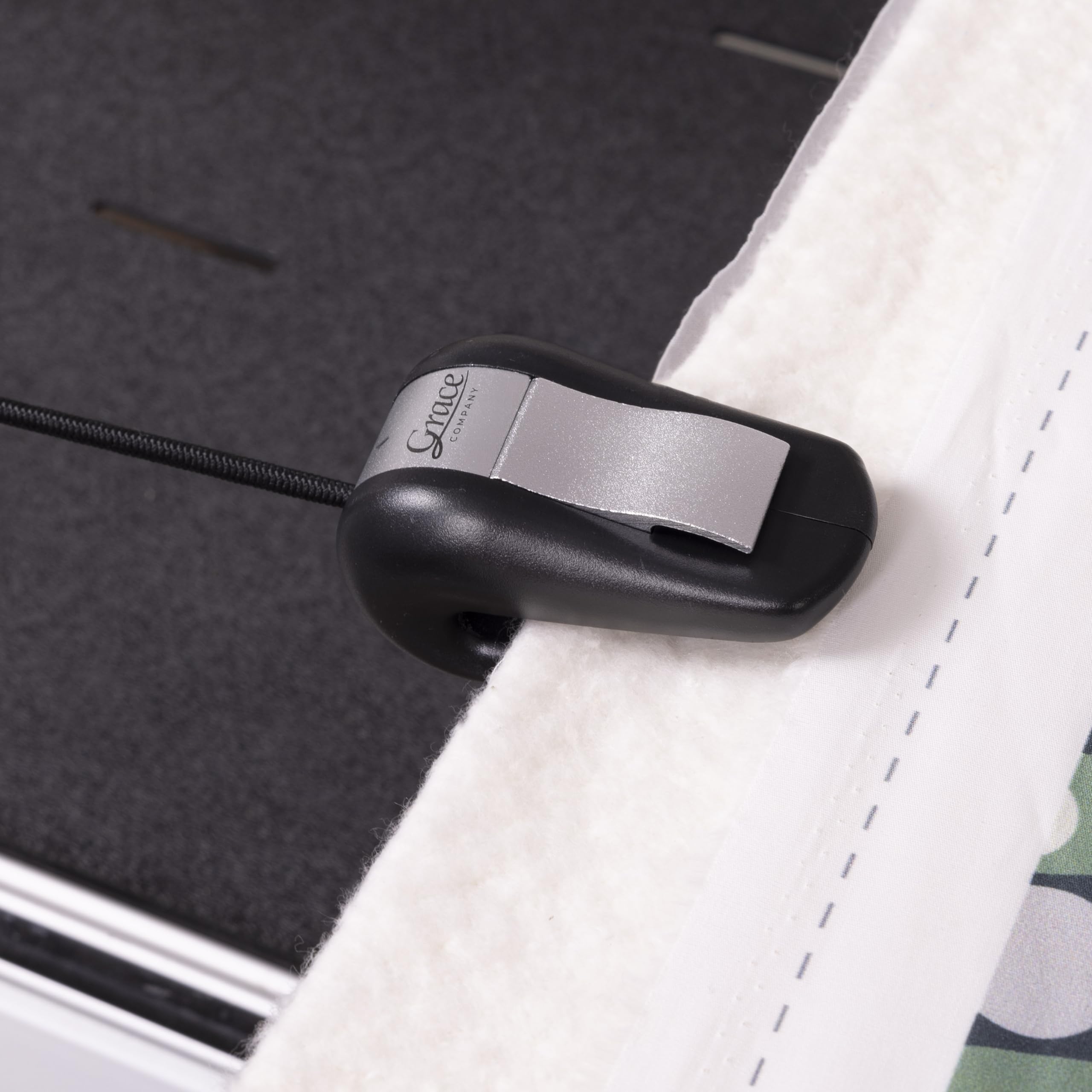 Grace Bungee Clamps clipping over fabric with minimal bulk.