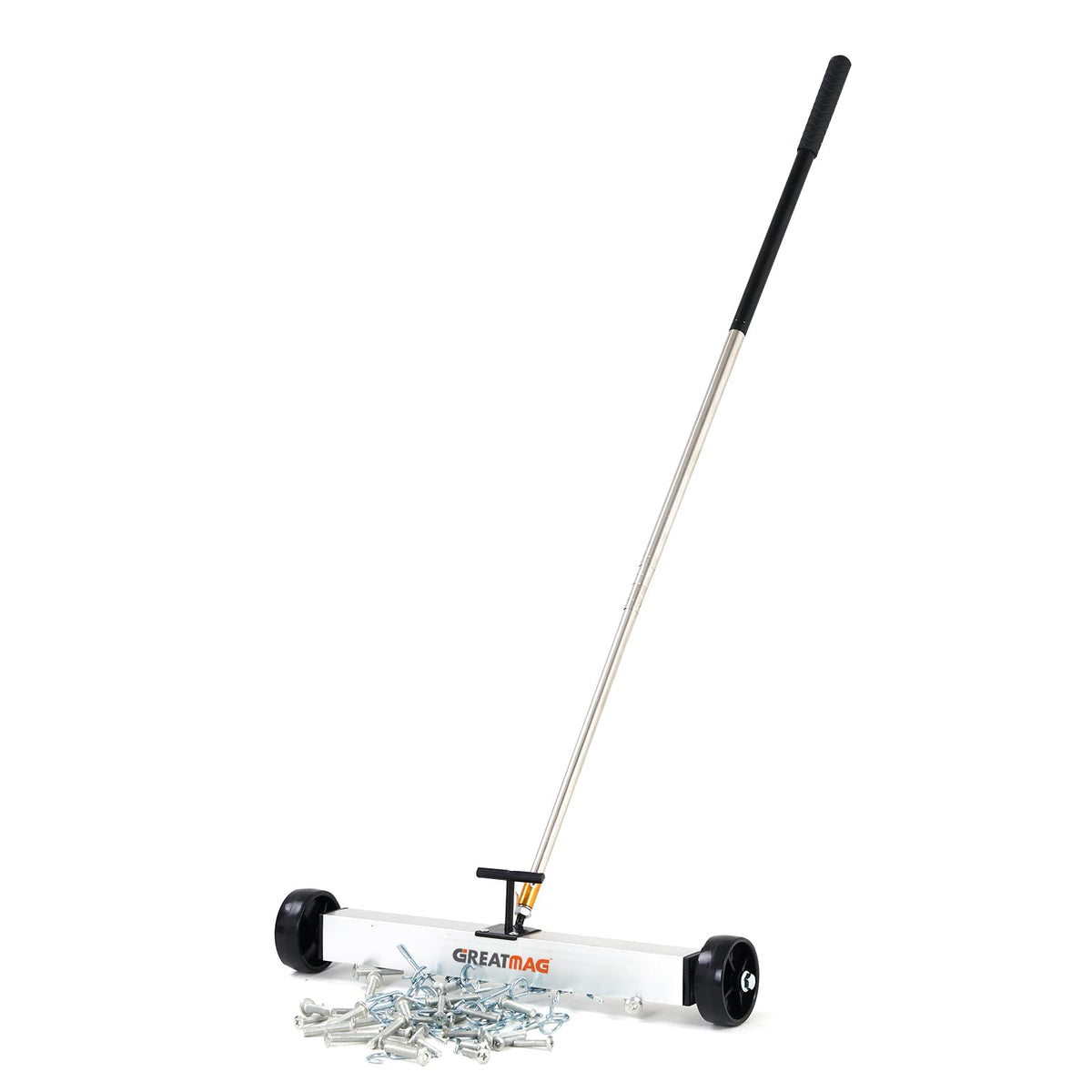 GreatMag rolling magnetic sweeper with 17-inch head lifting nails on concrete.