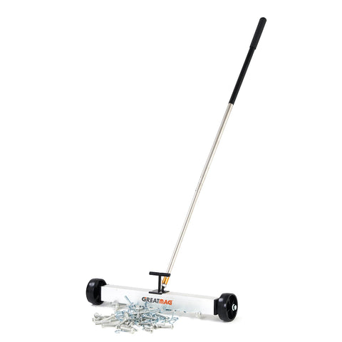 GreatMag rolling magnetic sweeper with 17-inch head lifting nails on concrete.