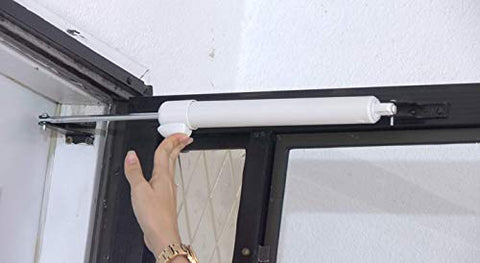 Greenstar door closer in storm door setup for weather-resistant entry control.