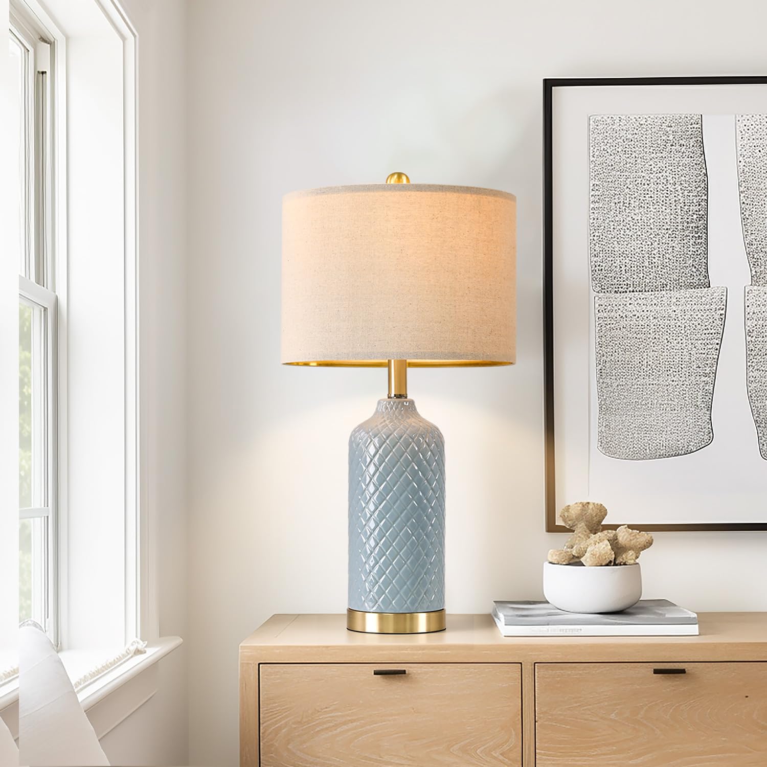 G-SAFAVA nightstand blue ceramic lamps provide ambient lighting.
