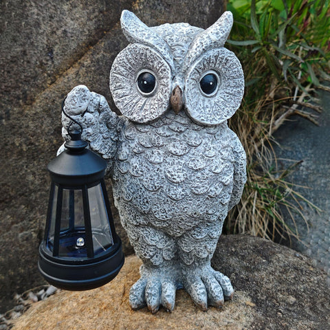 LED lantern casts subtle light along paths and flower beds.