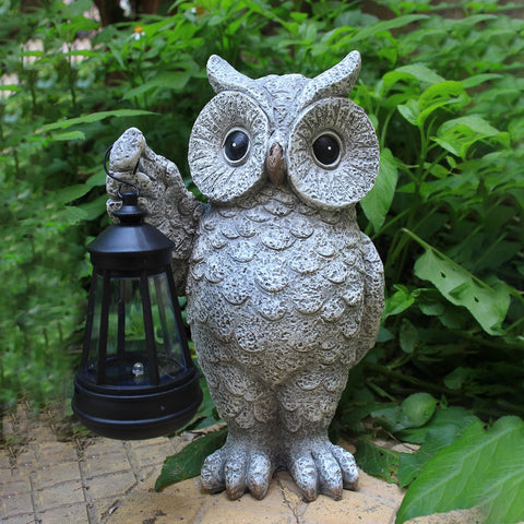 GUANFU weather-resistant owl statue illuminates paths with a warm LED glow.