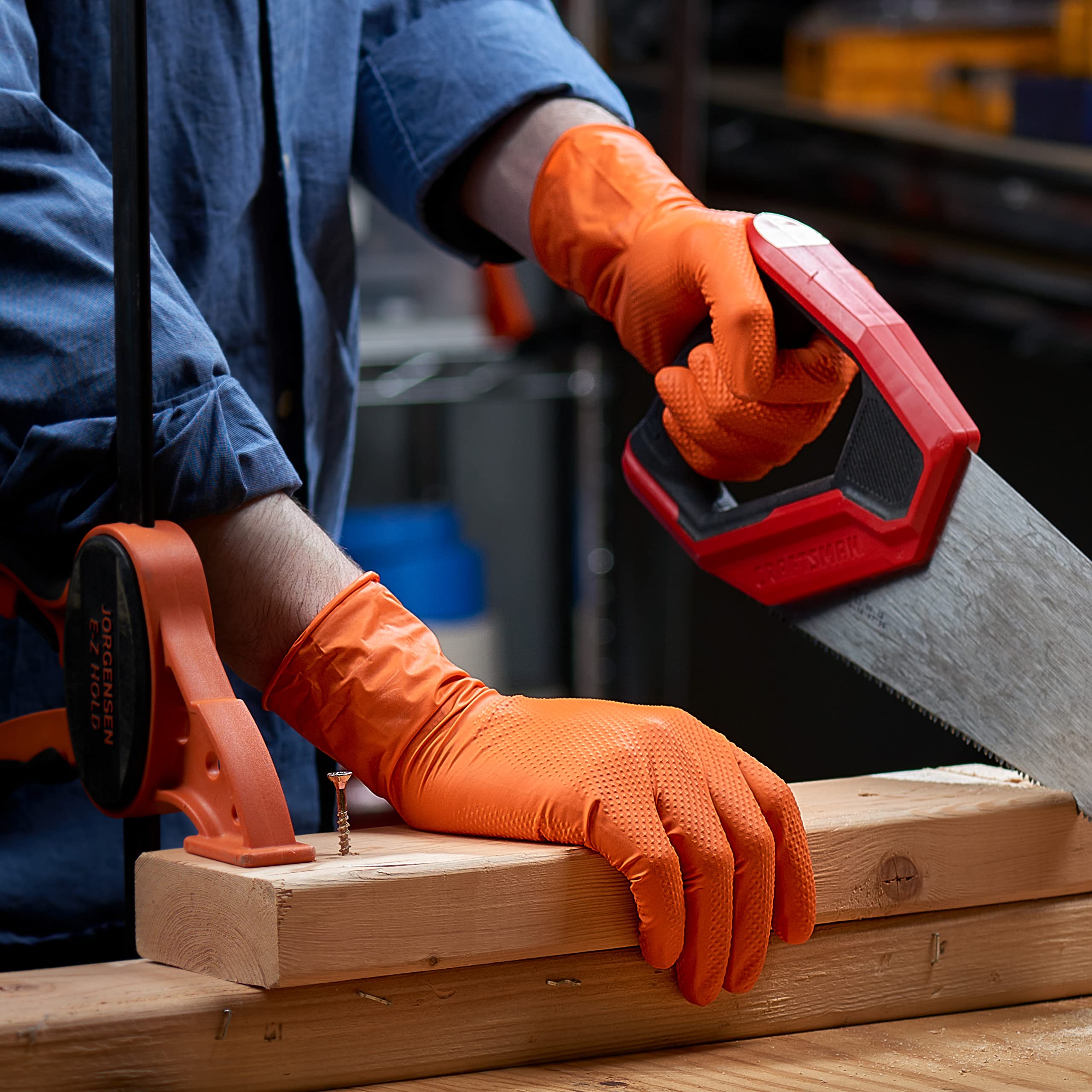 GUSTO gloves on mechanic tools demonstrating precision and control.