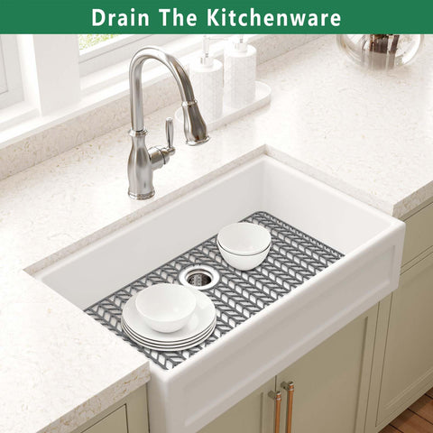 GUUKIN elevated water flow mat promotes drying and keeps dishes off the sink bottom