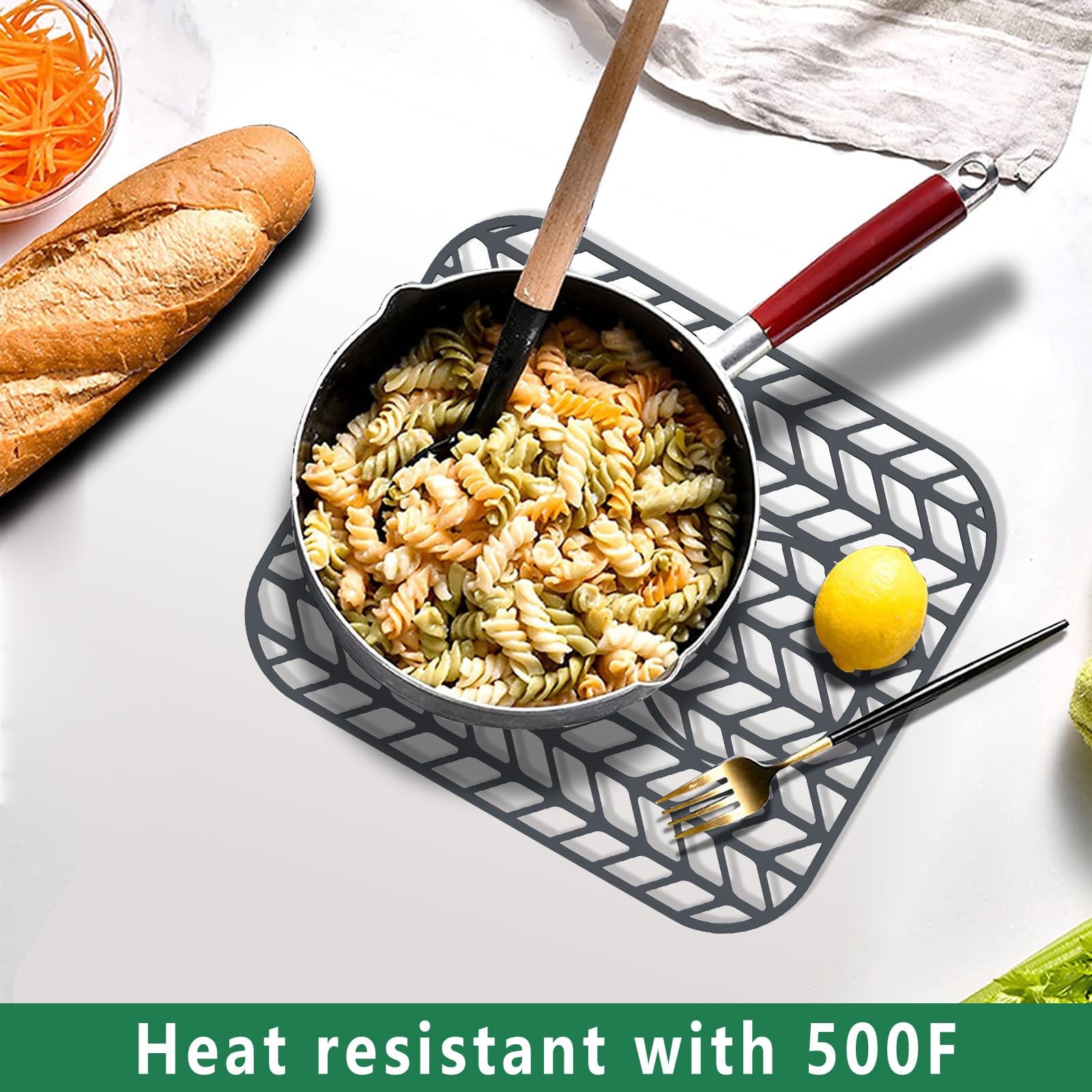 GUUKIN folding silicone sink mat displayed folded for space-saving storage.