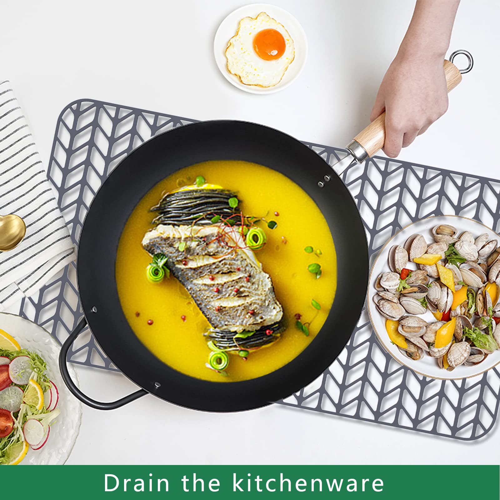 GUUKIN silicone kitchen mat in grey is heat-safe for pots from the stove.
