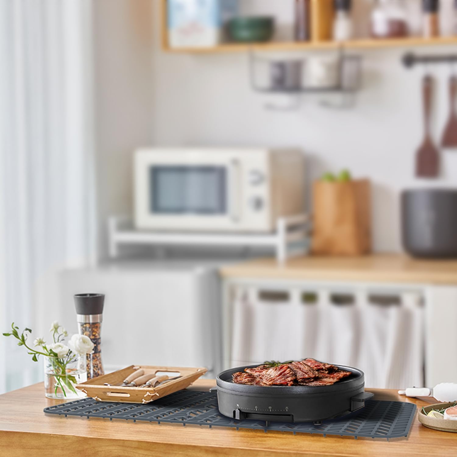 GUUKIN grey sink mat with three drain holes elevates drying items.