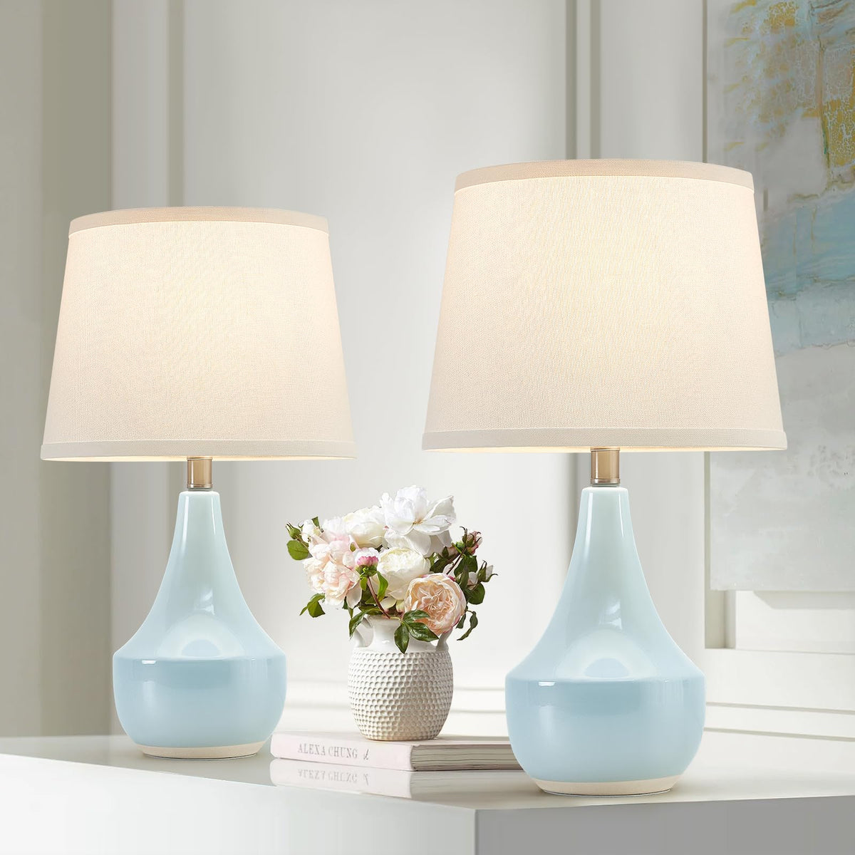 GyroVu sky-blue ceramic table lamp base adds calm ambiance to a living room