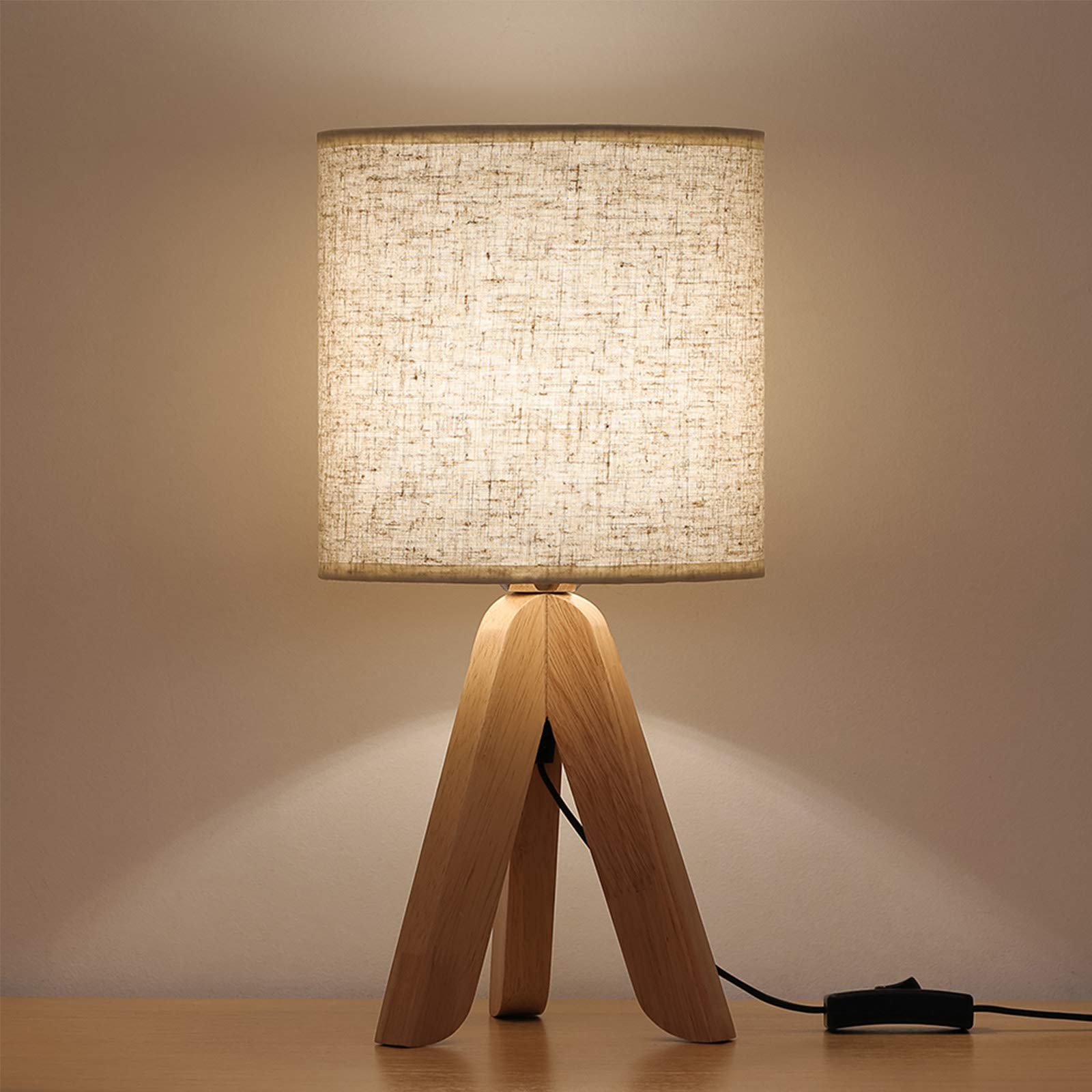 HAITRAL small bedside lamp with wooden tripod base for warm ambience.